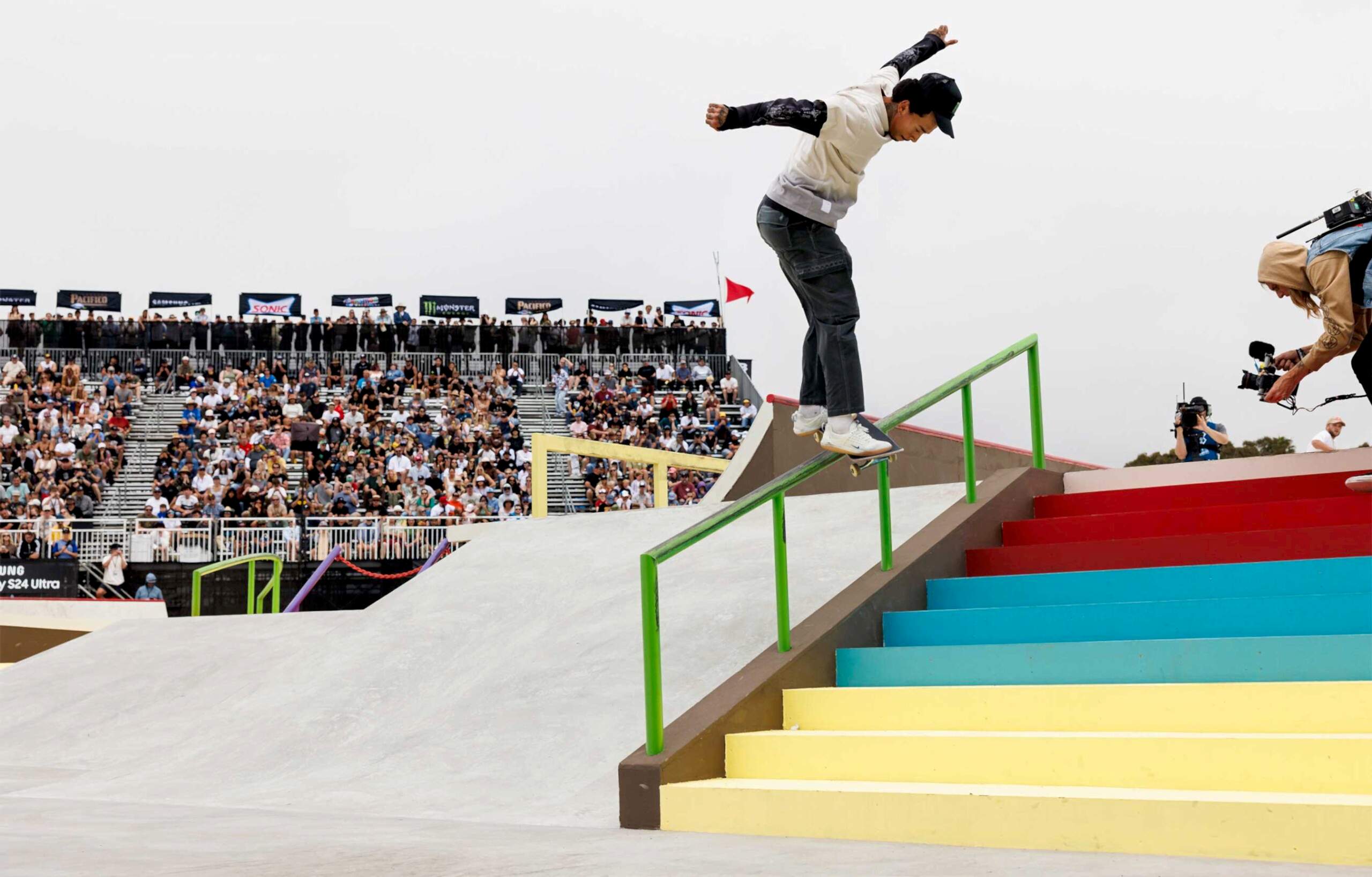 Nyjah Houston grinding down a ten-stair rail at the competition